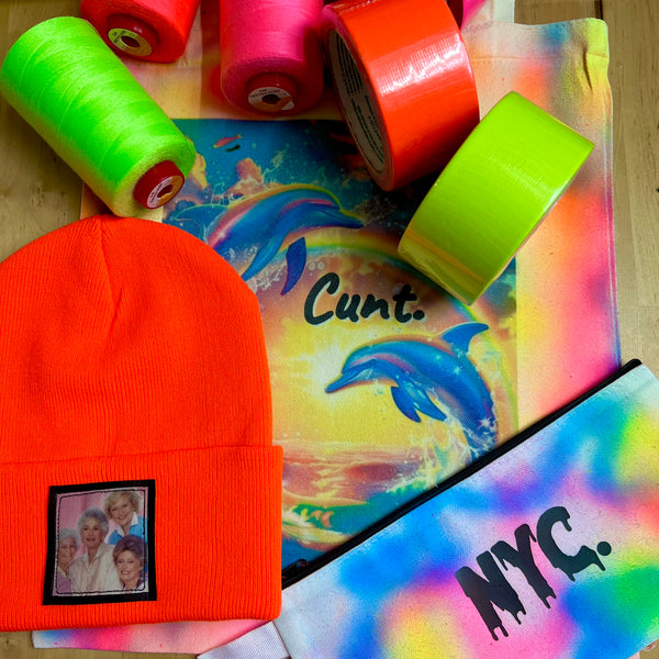 Orange beanie, neon thread and printed pieces