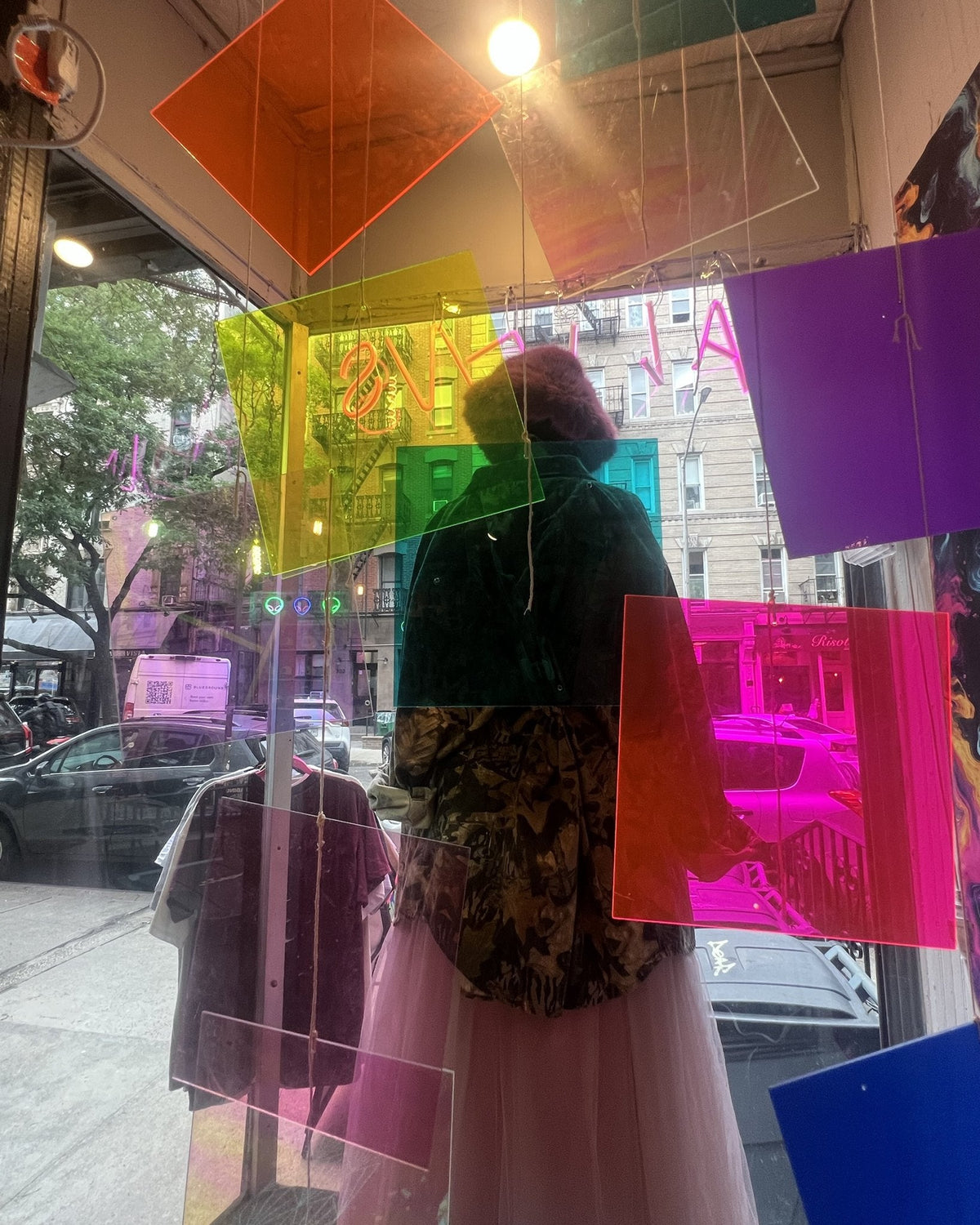 Front window with colored acrylic panels and mannequin, Aliens of Brooklyn, 304 E 5th St