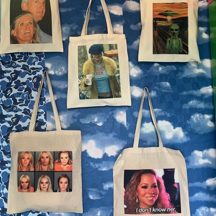 Printed canvas tote bags hanging on the wall